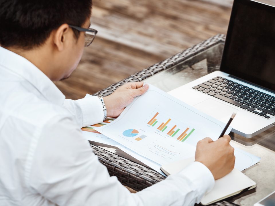 Business Concept - Young Business man woking on Financial plan. Strategy Analysis.